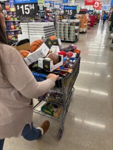 Every toy tells a story. Indy Christmas Light Pros team filled carts with gifts to support local families through Toys for Tots.