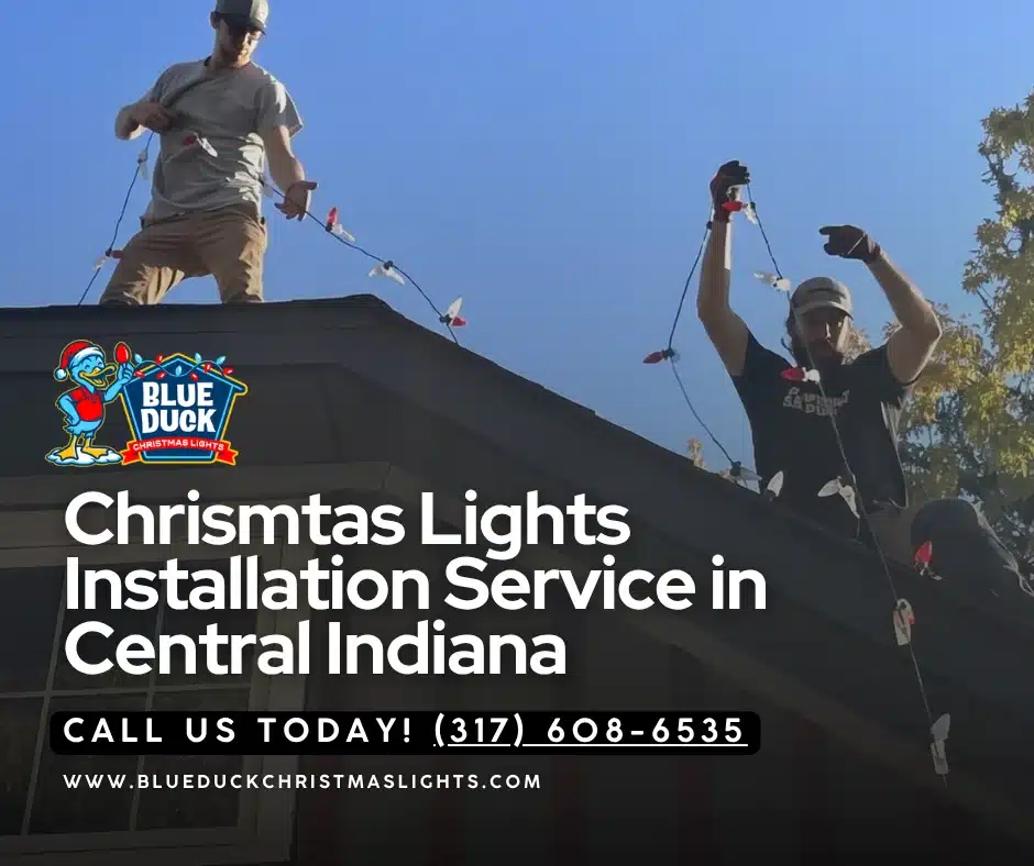 A trained Blue Duck Christmas Lights crew works on a holiday lighting installation in Noblesville, Central Indiana, securing custom exterior lighting and Christmas wreaths with damage-free attachment methods.