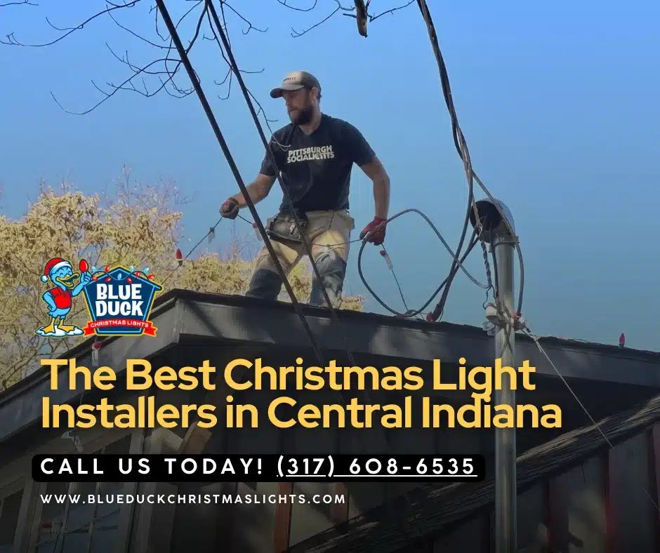 A Blue Duck Christmas Lights crew installs holiday season decoration on a roof of an Indianapolis home, providing professional Christmas lights installation with exterior lighting and tree & shrub lighting.