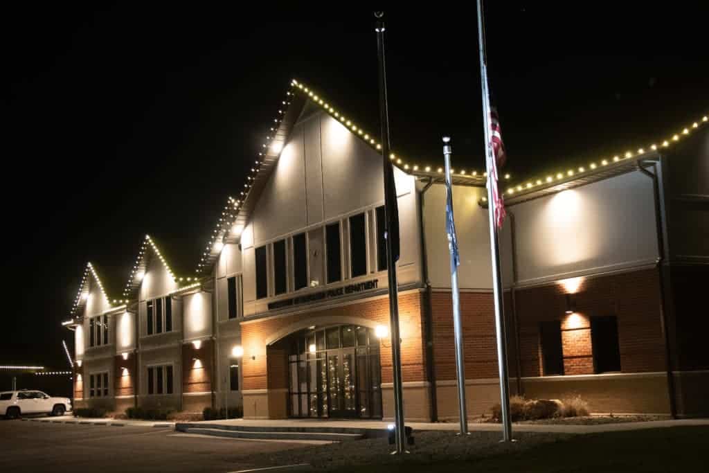 Retail store in Indiana featuring exterior commercial holiday lighting installed by Indy Christmas Pros.
